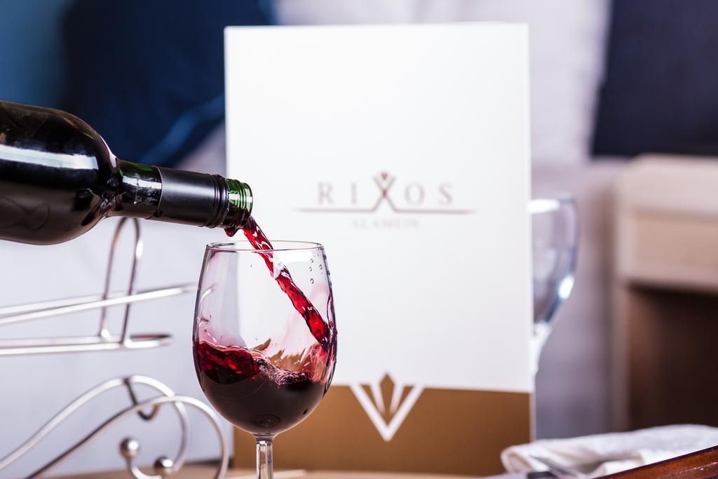 Rixos Alamein - Full Board Plus El Alamein Exteriör bild Wine being poured into a wine glass